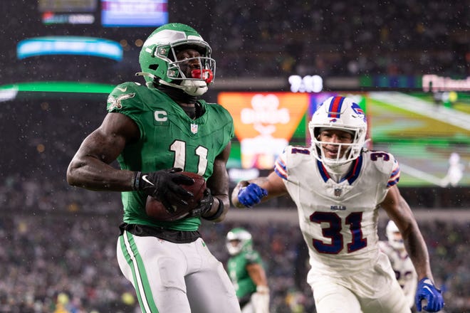 Nov 26, 2023; Philadelphia, Pennsylvania, USA; Philadelphia Eagles wide receiver A.J. Brown (11) makes a touchdown catch in front of Buffalo Bills cornerback Rasul Douglas (31) during the third quarter at Lincoln Financial Field. Mandatory Credit: Bill Streicher-USA TODAY Sports