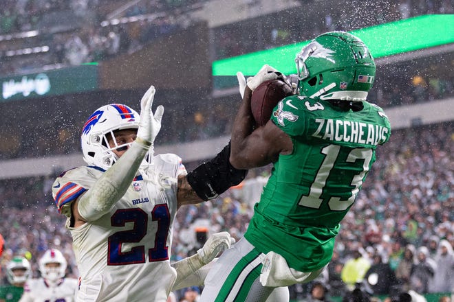 Nov 26, 2023; Philadelphia, Pennsylvania, USA; Philadelphia Eagles wide receiver Olamide Zaccheaus (13) makes a touchdown catch past Buffalo Bills safety Jordan Poyer (21) during the fourth quarter at Lincoln Financial Field. Mandatory Credit: Bill Streicher-USA TODAY Sports