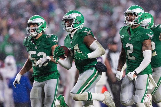 Nov 26, 2023; Philadelphia, Pennsylvania, USA; Philadelphia Eagles cornerback James Bradberry (24) celebrates with cornerback Darius Slay (2) and linebacker Christian Elliss (53) after his interception against the Buffalo Bills during the third quarter at Lincoln Financial Field. Mandatory Credit: Bill Streicher-USA TODAY Sports