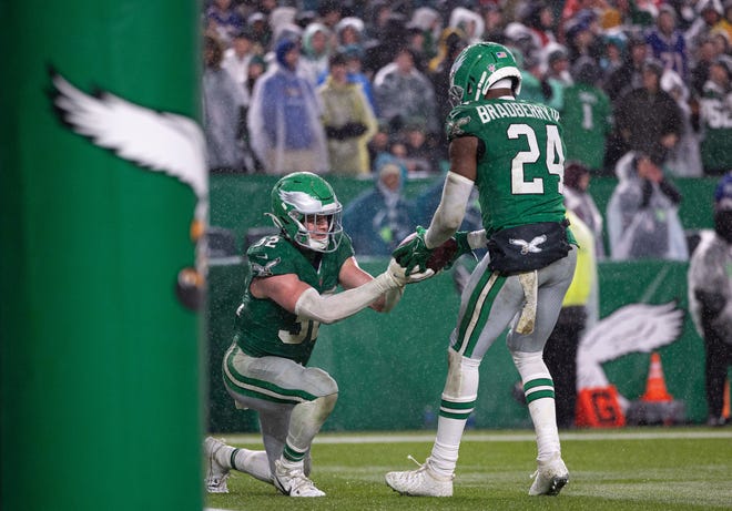 Nov 26, 2023; Philadelphia, Pennsylvania, USA; Philadelphia Eagles cornerback James Bradberry (24) celebrates his interception against the Buffalo Bills with safety Reed Blankenship (32) at Lincoln Financial Field. Mandatory Credit: Bill Streicher-USA TODAY Sports