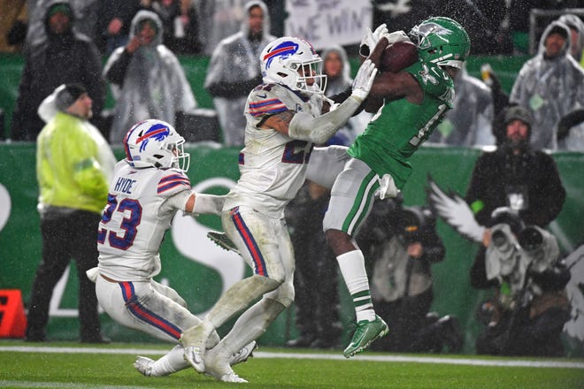 Nov 26, 2023; Philadelphia, Pennsylvania, USA; Philadelphia Eagles wide receiver Olamide Zaccheaus (13) catches touchdown pass against Buffalo Bills safety Jordan Poyer (21) during the fourth quarter at Lincoln Financial Field. Mandatory Credit: Eric Hartline-USA TODAY Sports