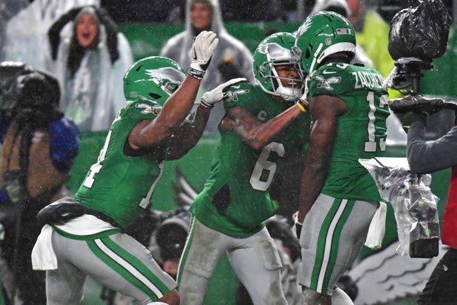 Nov 26, 2023; Philadelphia, Pennsylvania, USA; Philadelphia Eagles wide receiver Olamide Zaccheaus (13) celebrates his touchdown catch with running back Kenneth Gainwell (14) and wide receiver DeVonta Smith (6) against the Buffalo Bills during the fourth quarter at Lincoln Financial Field. Mandatory Credit: Eric Hartline-USA TODAY Sports