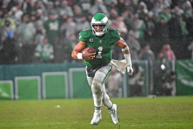 Nov 26, 2023; Philadelphia, Pennsylvania, USA; Philadelphia Eagles quarterback Jalen Hurts (1) runs with the ball during overtime win against the Buffalo Bills at Lincoln Financial Field. Mandatory Credit: Eric Hartline-USA TODAY Sports