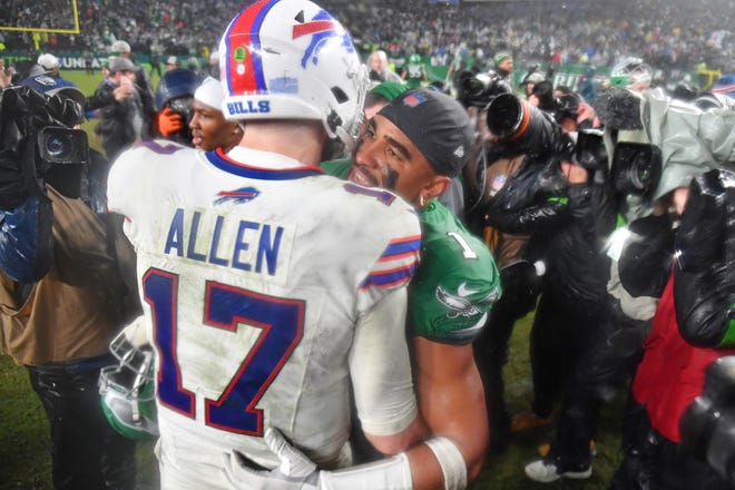 Nov 26, 2023; Philadelphia, Pennsylvania, USA; Buffalo Bills quarterback Josh Allen (17) and Philadelphia Eagles quarterback Jalen Hurts (1) meet on the field Eagles win in overtime at Lincoln Financial Field. Mandatory Credit: Eric Hartline-USA TODAY Sports