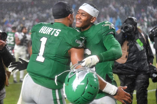 Nov 26, 2023; Philadelphia, Pennsylvania, USA; Philadelphia Eagles quarterback Jalen Hurts (1) snd wide receiver DeVonta Smith (6) walk off the field after overtime win against the Buffalo Bills at Lincoln Financial Field. Mandatory Credit: Eric Hartline-USA TODAY Sports