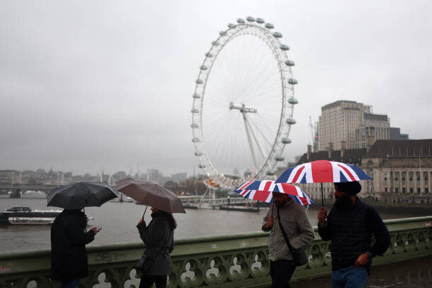 File photo of the London Eye. A tourist was left terrified as strong winds ripped an access hatch open while he was stuck inside (AFP via Getty Images)