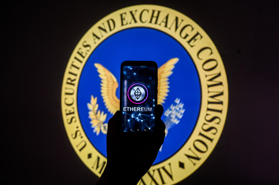 POLAND - 2024/01/17: In this photo illustration, an Ethereum logo is displayed on a smartphone with US Securities and Exchange Commission (SEC) logo in the background. (Photo Illustration by Omar Marques/SOPA Images/LightRocket via Getty Images)