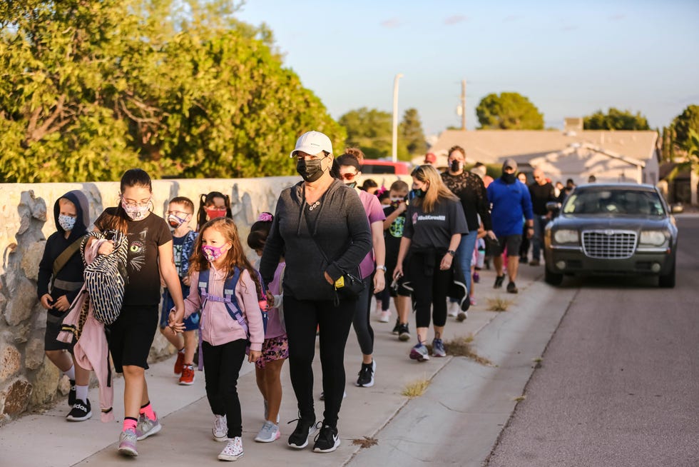 Students and parents walk to school on Oct. 6, 2021, in Las Cruces, N.M. Together, the city and county have won $800,000 from the U.S. Department of Transportation to plan ways to keep pedestrians, cyclists and drivers safe.
