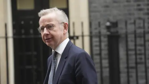 PA Media The Communities Secretary, Michael Gove, said funding the organisation 'posed a reputational risk to the government'