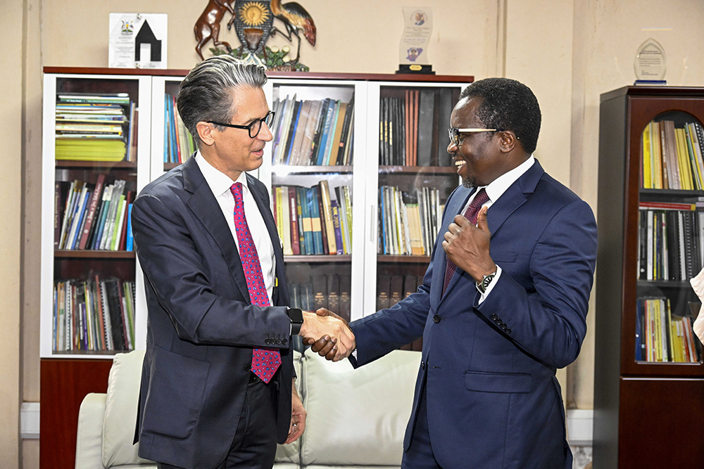 Principal Private Secretary (PPS) to President of Uganda Dr. Kenneth Omona Olusegun (right) shakes hands with the European Union Ambassador to Uganda Jan Sadek (left) as a sign of a successful meeting at the PPS officers in Kampala on February 27, 2024. 