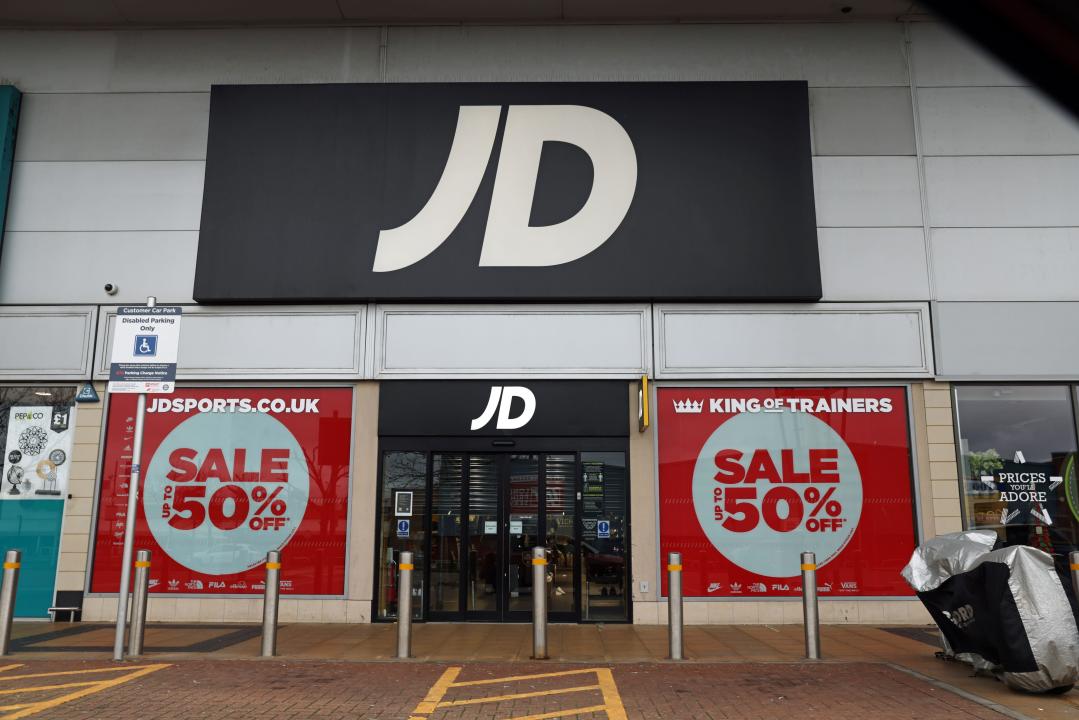 File photo dated 26/12/2020 of the doors to JD Sports at Greenwich Peninsular, south London. JD Sports has warned that less innovation in the products it sells has made its trading 