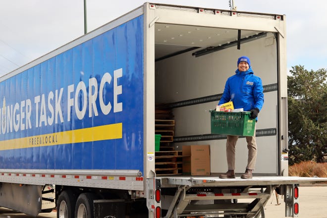 Food is loaded into a truck in Milwaukee County, as part of the Hunger Task Force's food donations programs.