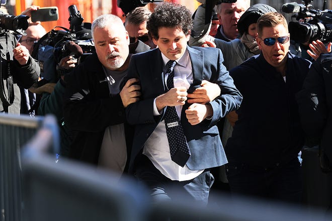 FTX Founder Sam Bankman-Fried arrives at Manhattan Federal Court for a court appearance on March 30, 2023 in New York City. A revised indictment was filed in federal court accusing Bankman-Fried of paying a $40 million bribe to one or more Chinese government officials. He has already been charged with eight criminal counts of fraud, conspiracy, and money-laundering offenses which include making illegal political contributions.