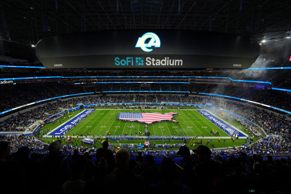 Dec 21, 2023; Inglewood, California, USA; A general overall view of SoFi Stadium with a United States flag on the field during the playing of the national anthem before the game between the Los Angeles Rams and the New Orleans Saints Mandatory Credit: Kirby Lee-USA TODAY Sports