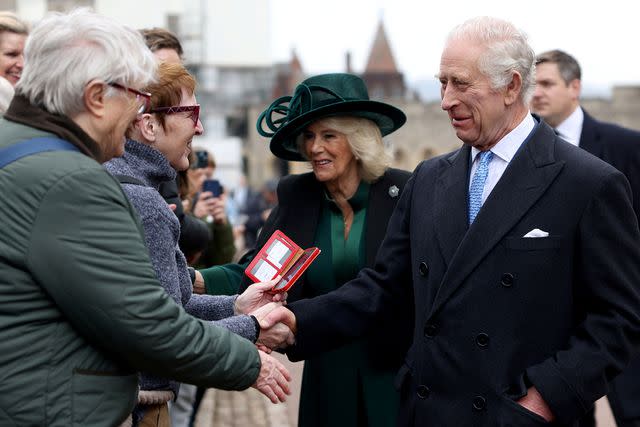 <p>Hollie Adams - WPA Pool/Getty Images</p> King Charles and Queen Camilla greet people after attending the Easter Matins Service at St. George's Chapel, Windsor Castle, on March 31, 2024.