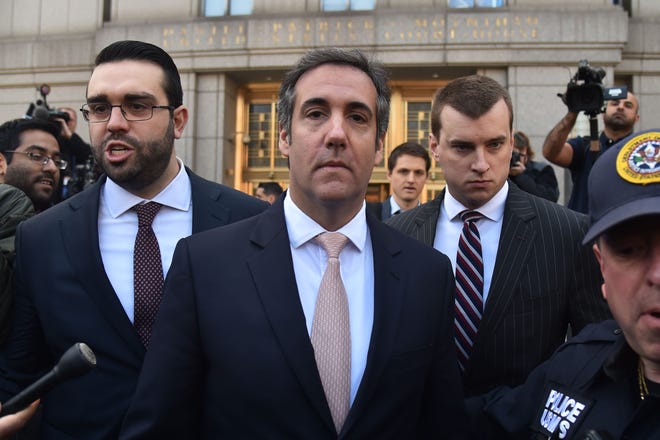 US President Donald Trump's personal lawyer Michael Cohen(C) leaves the US Courthouse in New York on April 26, 2018.
US President Donald Trump acknowledged on Thursday that his personal lawyer, Michael Cohen, represented him in a "deal" involving porn star Stormy Daniels. Trump had previously denied knowledge of a $130,000 payment Cohen made to Daniels that she claims was to prevent her from talking about their alleged 2006 affair.Trump, in a wide-ranging telephone interview with "Fox and Friends," admitted for the first time that Cohen represented him in a "deal" with Daniels, who has filed a lawsuit seeking to have the "hush agreement" negotiated by Cohen thrown out.
 / AFP PHOTO / HECTOR RETAMALHECTOR RETAMAL/AFP/Getty Images ORG XMIT: 486 ORIG FILE ID: AFP_14C9BX