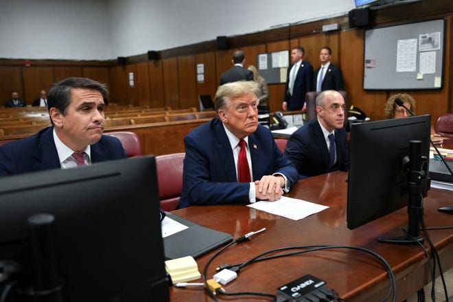 Former U.S. President Donald Trump attends the first day of his trial for allegedly covering up hush money payments linked to extramarital affairs, at Manhattan Criminal Court in New York City on April 15, 2024. Trump is in court on April 15, 2024, as the first U.S. ex-president ever to be criminally prosecuted, a seismic moment for the United States as the presumptive Republican nominee campaigns to re-take the White House. The scandal-plagued 77-year-old is accused of falsifying business records in a scheme to cover up an alleged sexual encounter with adult film actress Stormy Daniels to shield his 2016 election campaign from adverse publicity.