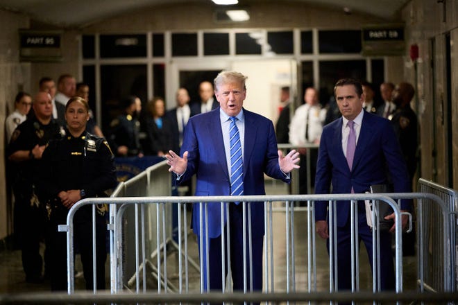 Former President Donald Trump speaks before entering the courtroom on the second day of his trial at Manhattan Criminal Court, New York City, New York, U.S. April 16, 2024.