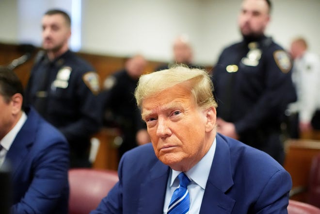 Former President Donald Trump awaits the start of proceedings on the second day of jury selection at Manhattan criminal court, New York City, New York, U.S. April 16, 2024.