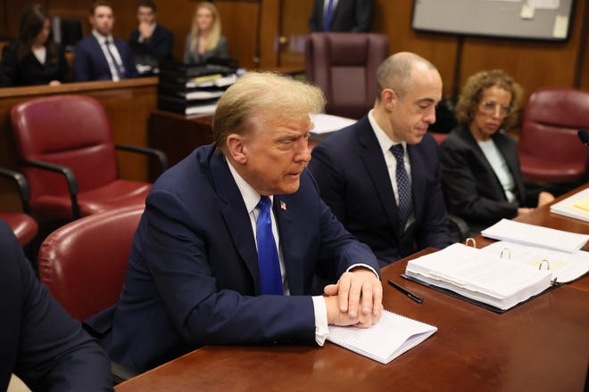 Former President Donald Trump sits in the courtroom during his trial over charges that he falsified business records to conceal money paid to silence porn star Stormy Daniels in 2016, in Manhattan state court in New York City, U.S. April 18, 2024.