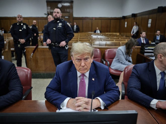 Former President Donald Trump and his defense team sit in Manhattan Supreme Court on Day 4 of his trial for allegedly covering up hush money payments in New York, U.S. April 19, 2024.
