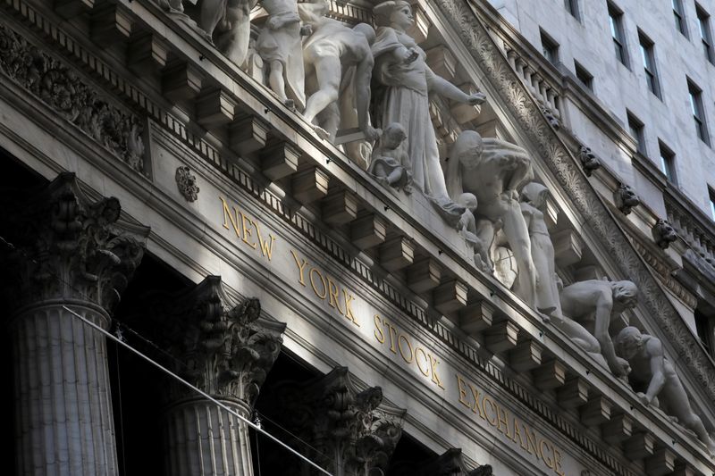 © Reuters. FILE PHOTO: Morning sunlight falls on the facade of the New York Stock Exchange (NYSE) building after the start of Thursday's trading session in Manhattan in New York City, New York, U.S., January 28, 2021. REUTERS/Mike Segar/File Photo