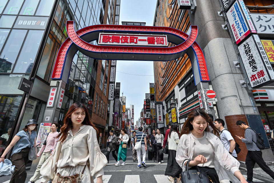 ftse Pedestrians walk along a street in the Kabukicho entertainment area of Shinjuku in Tokyo on April 29, 2024, as the country marks the national holiday of 