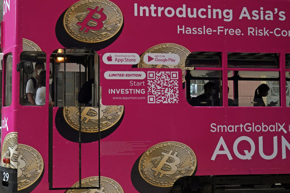 Bitcoin, one of the cryptocurrencies, is displayed on a tram in Hong Kong, 