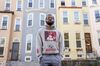 Terrence Jones Jr. outside his childhood home on Walbrook Avenue.