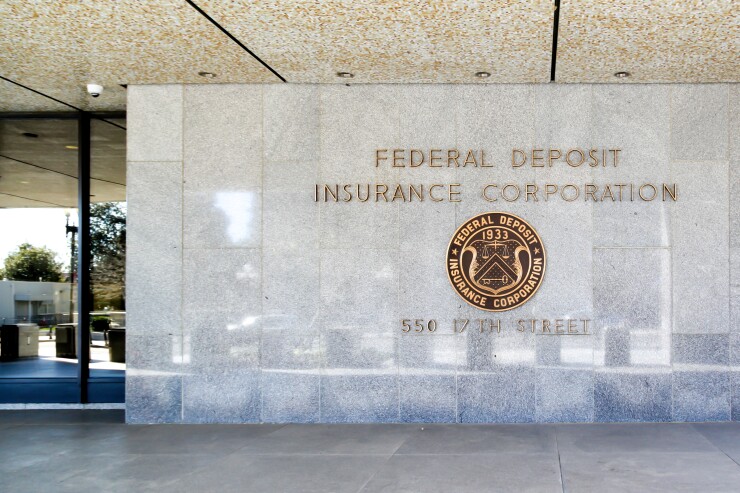 Washington D.C., USA - March 1, 2020: Sign and seal of The Federal Deposit Insurance Corporation (FDIC), an federal agency insuring deposits in U.S. banks and thrifts in the event of bank failures. 