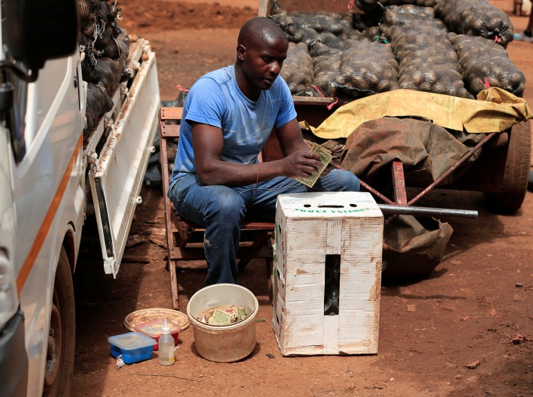 A money trader in Zimbabwe