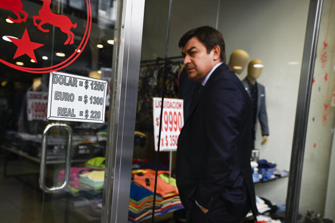The exchange rate of the Argentine peso against the US dollar, the euro and the Brazilian real is displayed in the window of a clothing store in Buenos Aires on January 10, 2024.