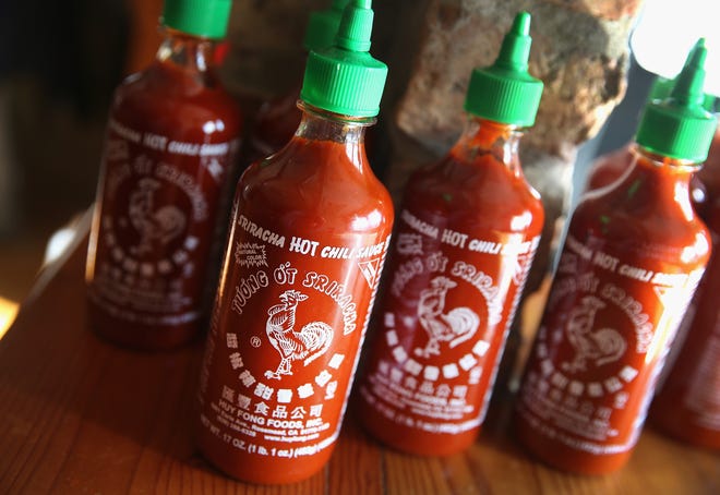 Bottles of Huy Fong Foods' Sriracha hot chili sauce are shown on December 12, 2013 in Chicago, Illinois.