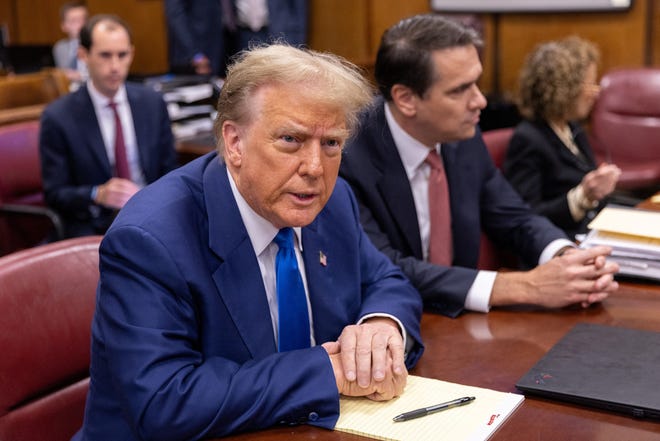 Former US President Donald Trump sits in the courtroom at Manhattan criminal court in New York, US, on Friday, May 3, 2024. Trump faces 34 felony counts of falsifying business records as part of an alleged scheme to silence claims of extramarital sexual encounters during his 2016 presidential campaign.