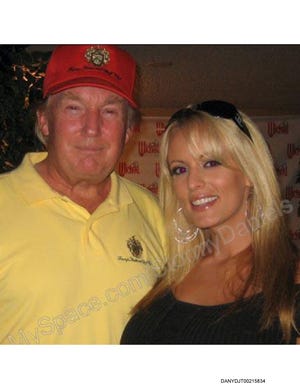 Image of Donald Trump with Stormy Daniels introduced as evidence on May 7, 2024 in the People of the State of New York v. Donald J. Trump criminal trial charging the former President with falsifying business records to conceal a hush money payment that was designed to unlawfully interfere with the 2016 election.