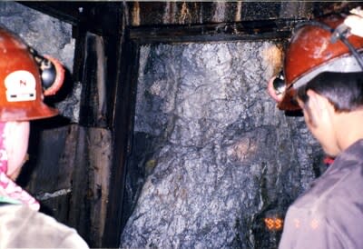 Photo of massive sulfide face at the head of the Lower Rufus Adit (1989) (CNW Group/Metallis Resources Inc.)
