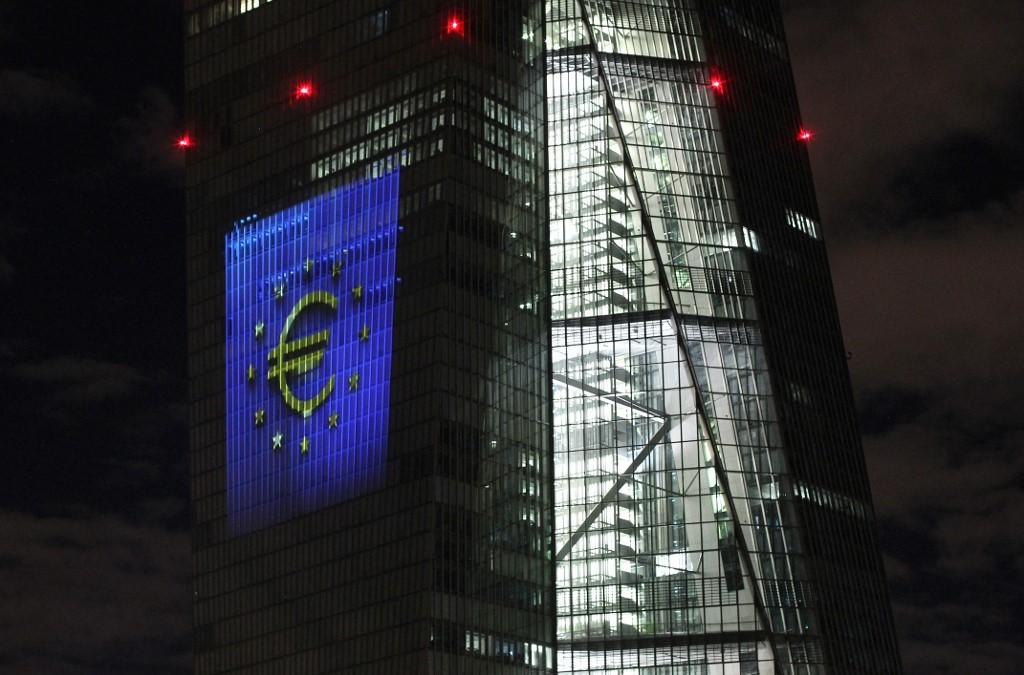 A euro symbol projection on a giant screen on the European Central Bank headquarters in Frankfurt on Friday night. Photo: AFP