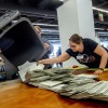 Elections workers empty a bin to count postal ballots for the European Union elections in Frankfurt, Germany, on Sunday, June 9, 2024.