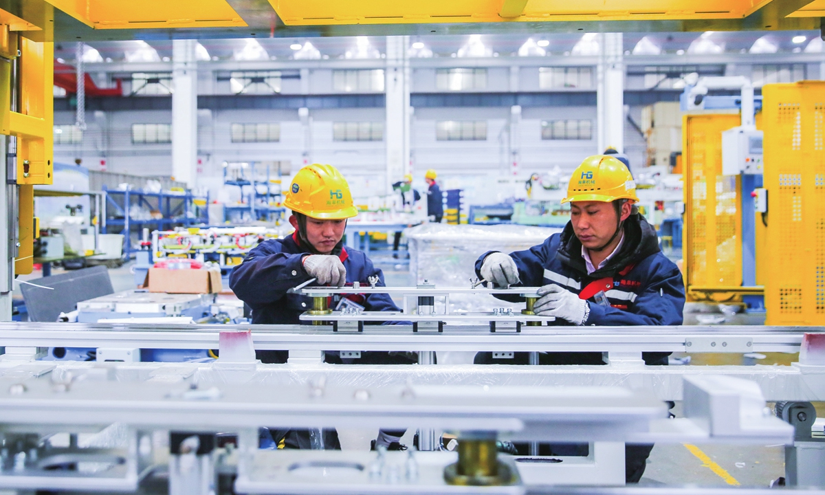 Workers rush to produce a batch of auto parts for clients in Poland at a company in Nantong, East China's Jiangsu Province on January 22, 2024. As the country promotes high-quality development, a number of auto parts makers have provided high-quality products to hundreds of domestic and foreign enterprises. Photo: VCG