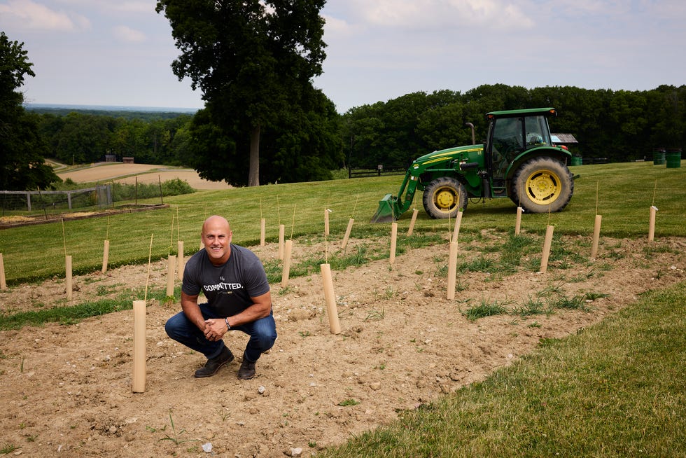 Greg Clement poses for a portrait at Mapleside Farms in Brunswick, Ohio, on June 14. Clement runs a house-flipping company. He also owns an apple orchard and a winery, and he's into motorcycles.