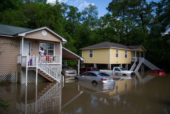 Residents who live in two homes on Ridge Road are trapped due to floodwater left behind after torrential rain on Thursday, April 11, 2024.