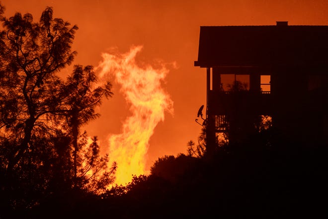 The French Fire comes close to destroying homes on August 24, 2021 in Wofford Heights, California.