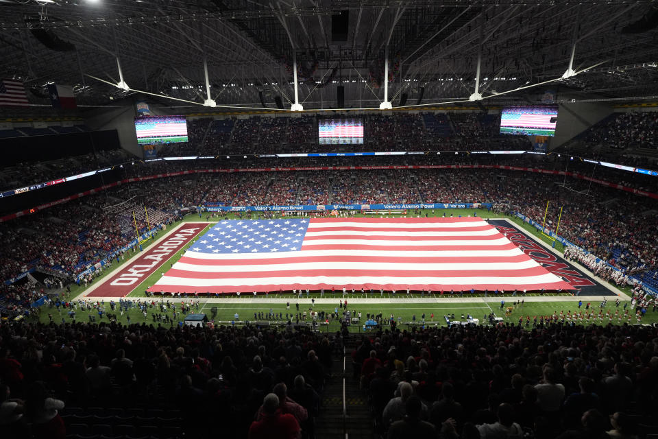 Dec 28, 2023; San Antonio, TX, USA; A general overall view of a United States flag on the field during the playing of the national anthem at the Alamo Bowl between the Arizona Wildcats and the Oklahoma Sooners at Alamodome. Mandatory Credit: Kirby Lee-USA TODAY Sports