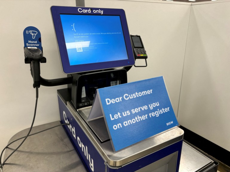 A blue error screen on a register is seen at a departmental store affected by a cyber outage in Brisbane, Australia