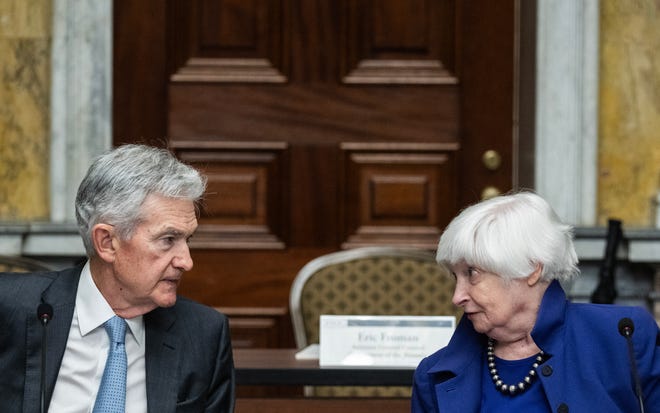 Chair of the Federal Reserve Jerome Powell speaks with Treasury Secretary Janet Yellen before an open session of the Financial Stability Oversight Council at the Treasury Department in Washington, DC on May 10, 2024.