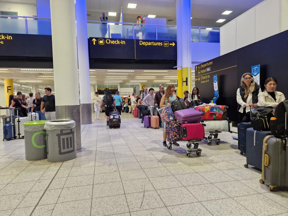 Passengers at London Gatwick Airport, Crawley, east Sussex, following delays amid reports of widespread IT outages affecting airlines, broadcasters and banks. Picture date: Friday July 19, 2024.
