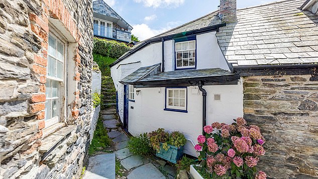 This pretty two-bedroom cottage has gone on the market at £415,000