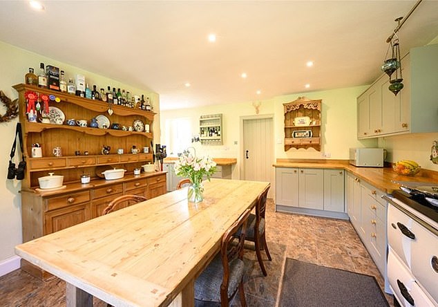 This three-bedroom cottage enjoys stunning views of the surrounding woodland