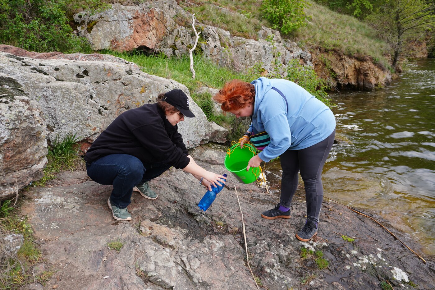 Researchers from the Ukrainian NGO Ecoaction are taking water measurements in Vinnytsia