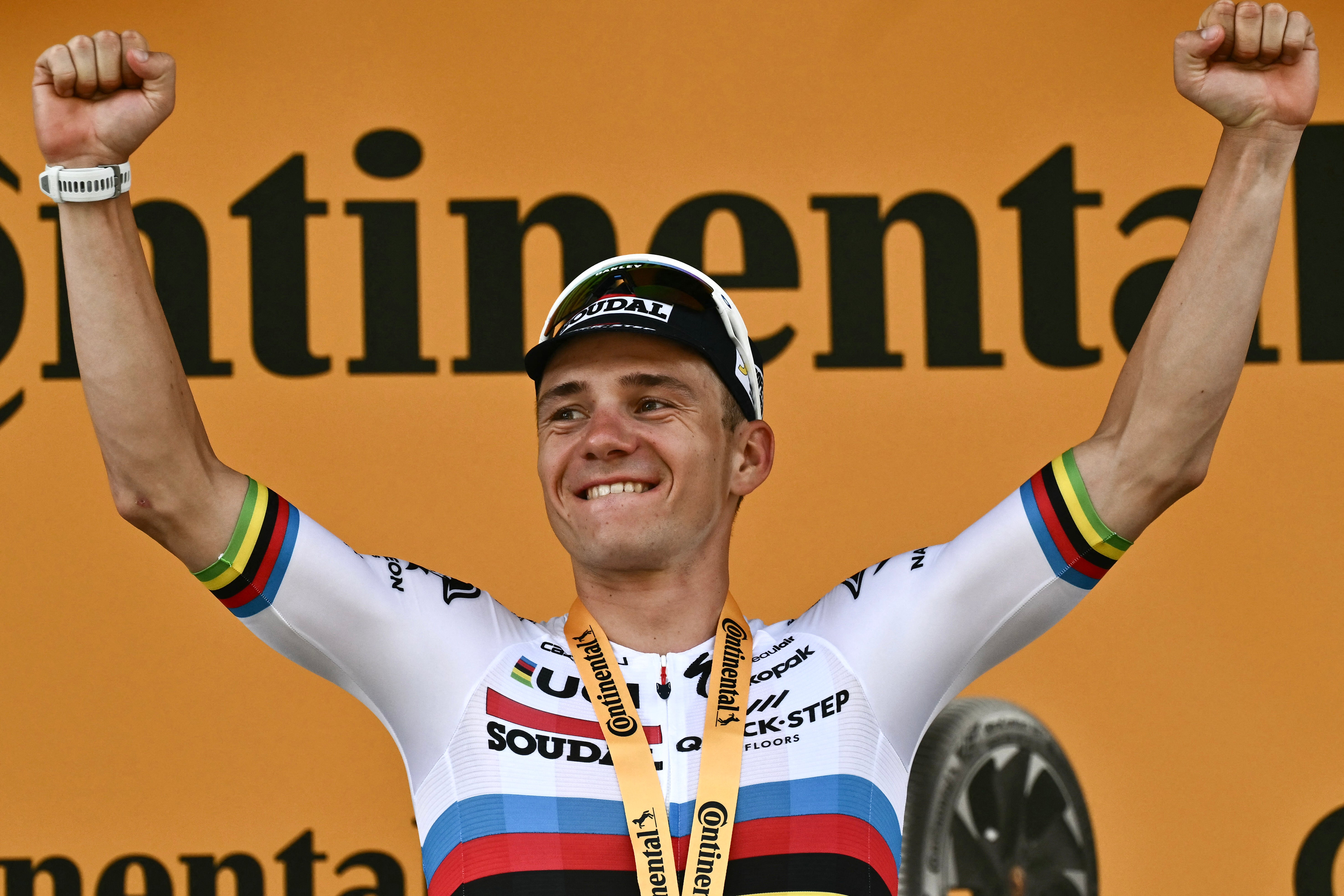 Remco Evenepoel celebrates winning the first individual time-trial